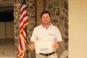 Jeff Daniels of Greenwing Lawn & Pest services receives his certification. 