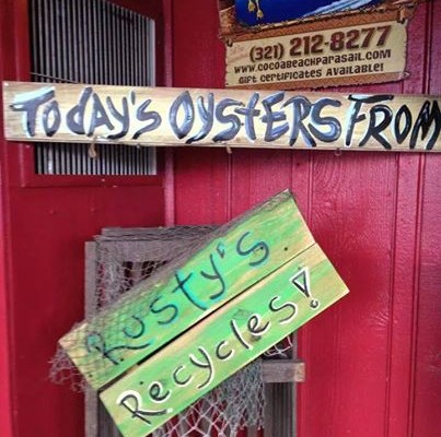 A sign at Rusty's restaurant that says: Rusty's Recycles!